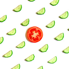 repeating pattern of sliced semicircles of fresh raw vegetable cucumbers for salad and a slice of tomato in the center isolated on a white background flat lay, top view. square