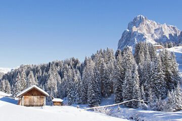 Wooden chalets on a snowy ski slope, Seiseralm
