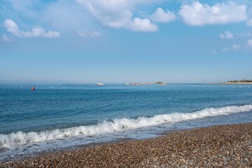 Ocean wave with spray, sea summer. liquid sky