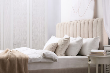 Elegant room interior with large comfortable bed