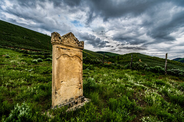Old headstone in graveyard