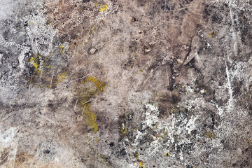 Background image of a grunge texture in gray-brown tones. Abstract background with stains of rust, dirt and paint.