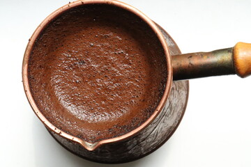 freshly brewed coffee in cezve