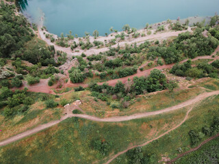 overhead top view of flooded mine lake with blue water