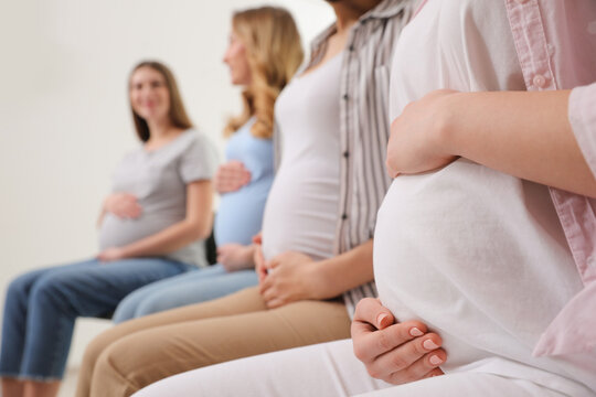 Group of pregnant women at courses for expectant mothers indoors
