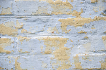 Peeling paint wall. Empty old brick wall texture. Painted problem wall surface.
