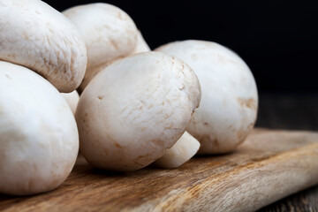 unwashed mushrooms champignon during cooking