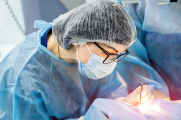 Obraz na płótnie Canvas Emergency operating treatment. Professional medical worker in operation room.