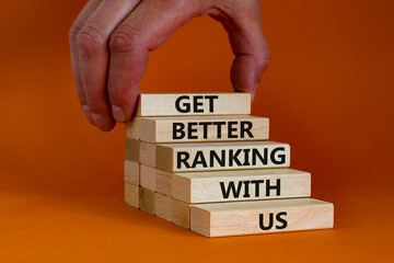 Get better ranking with us symbol. Wooden blocks with words 'Get better ranking with us'. Businessman hand. Beautiful orange background, copy space. Business, get better ranking with us concept.