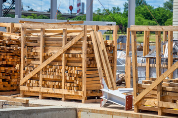 Fototapeta na wymiar Stack of wooden beams and lumber material
