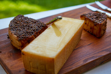 Cheese party table, perfect holiday appetizer on rustic wooden board