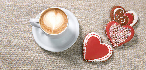 Obraz na płótnie Canvas Prepared with love. Top view shot of delicious cup of coffee and Valentine’s day cookie snacks