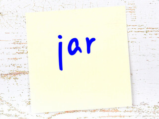 Yellow sheet of paper with word jar. Reminder concept