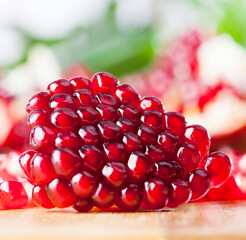red and ripe pomegranate with juicy grains