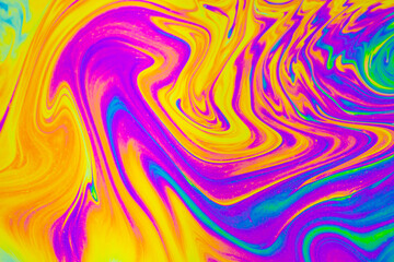 Rainbow colors. Psychedelic multi colored patterns background. Photo macro shot of soap bubbles.