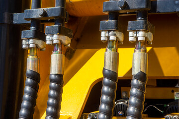Close up of pipe system of hydraulic valves