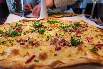 Traditional Alsace tarte flambée ready to eat