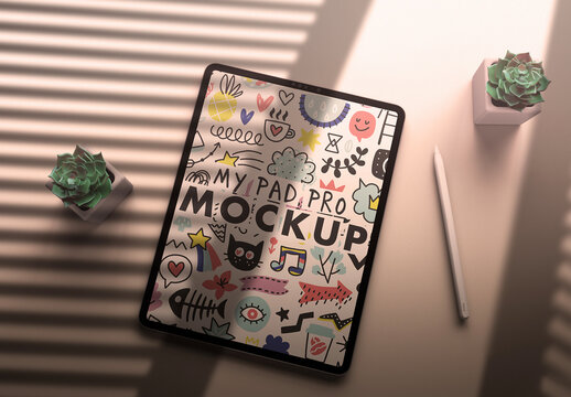 Tablet Mockup on a Morning Shadow Desk and Trendy Succulents Green Flowers