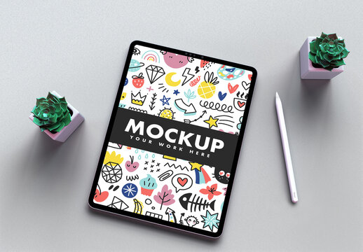 Tablet Mockup on a Texturized Light Gray Desk and Trendy Green Succulents Flowers