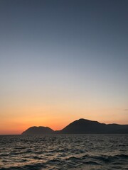 Fototapeta na wymiar Sunset over the sea and mountains in Greece, Rio.