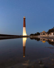 Dark starry night sky over Barnegat Lighthouse on the Jersey shore. 