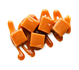 Caramel candies with topping on white background, top view
