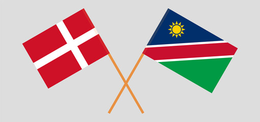 Crossed flags of Denmark and Namibia. Official colors. Correct proportion