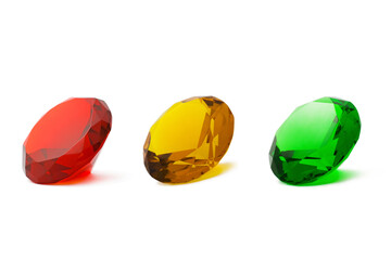 Red, yellow, green transparent gems isolated on white