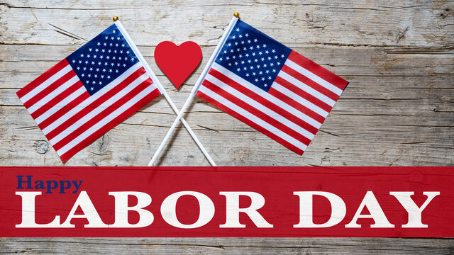 Happy Labor Day background banner greting card template - American flags, red heart and lettering, isolated on rustic wood texture, wooden table, top view