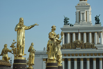 Fototapeta na wymiar Statues and facades of VDNKh in Moscow