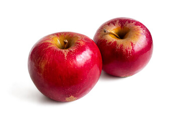 Two fresh red apples on a white background