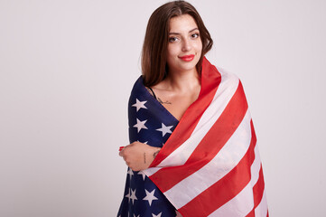 Beautiful sport woman holding american flag