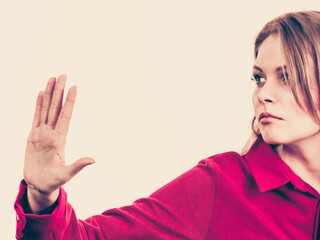 Woman showing stop gesture