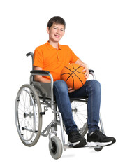 Disabled teenage boy in wheelchair with basketball ball on white background