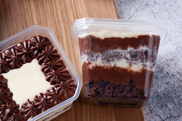 Chocolate cake in the pot for delivery.  Copy space.