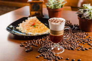 Naklejka na ściany i meble Delicious Layered Cappuccino Coffee Drink Cinnamon Chocolate Caramel Breakfast On Wooden Table Baker Bakery