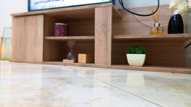 macro focused wooden tv stand with floor closeup,home decor idea