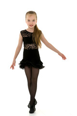 Cute little girl in a dance suit, on a white background.