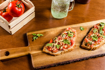 Delicious Bruschetta Toast Cheese Tomato Basil on a Rustic Wooden Plate Baker Artisan Pomodoro