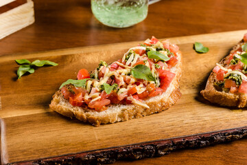 Delicious Bruschetta Toast Cheese Tomato Basil on a Rustic Wooden Plate Baker Artisan Pomodoro
