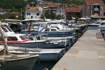Boats and boats in the port against the backdrop of the city, Tivat, Montenegro.
