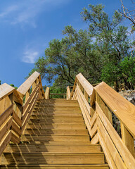 Fototapeta na wymiar Wooden staircase in the mountain range