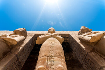 antique statue in the pillared hall in Luxor in Egypt