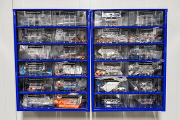 Two cabinets with drawers with spare components for air.