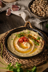Delicious hummus in ceramic bowl