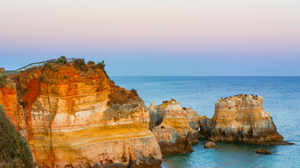 Fototapeta na wymiar Rocks on the ocean coast at sunset