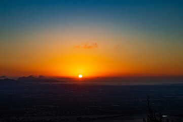 Special Sunrise at Pollença bay- bird flying over mediterranean sea- Orange sky- Colorful sky- Calm water- meditation time