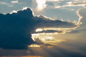 Beautiful evening cloudy sky. Pink warm clouds at the sunset.