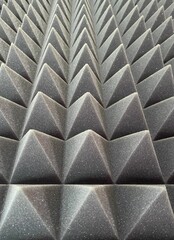 Soundproof shock-absorbing acoustic foam for the recording studio and any room. The texture of the volumetric pyramids of the three-dimensional volume of triangles.