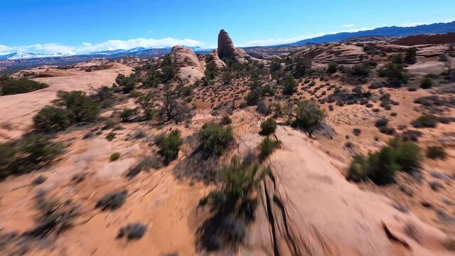 Slickrock moab utah arial shot dry desert rock structures sunny landscape